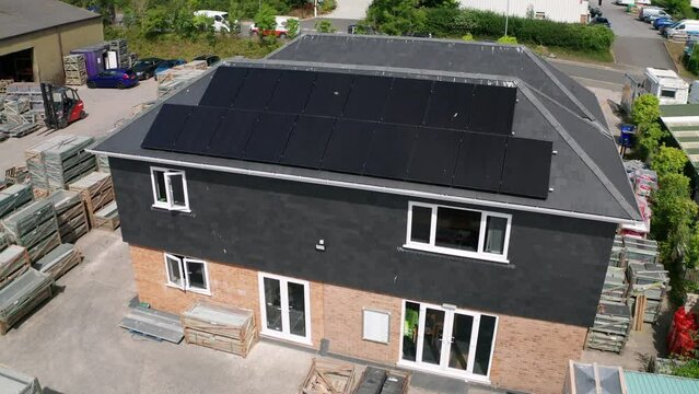 Solar photovoltaic commercial installation renewable energy at busy slate yard