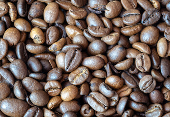 Roasted coffee beans, coffee beans, background.