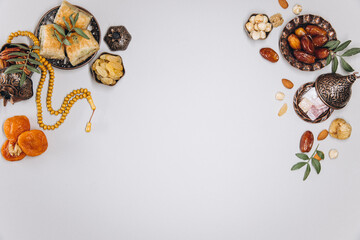 Traditional table for Ramadan. Set of dried fruits, on old islamic tableware, top view, copy space.