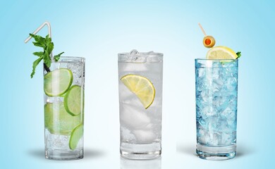 Set of drink, soda and lemonade in glasses.