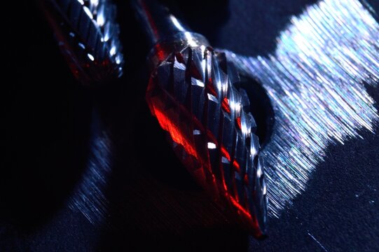 cutters of tungsten carbide on the background of metal blanks. Close-up.