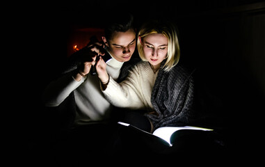 A couple in love at home during a power outage. Blackout, no electricity
