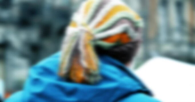Defocused blur view ofo man with rasta hat at second demonstration protest march against the new pension reform to be presented next month by French Prime Minister