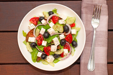 Greek salad with fresh vegetables closeup
