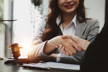 Image of Consultation between a lawyer and business people and Handshake after deal in good contract