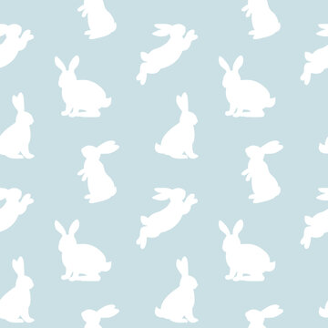 Seamless pattern with white rabbit silhouette  in different position on blue background. Vector illustration.