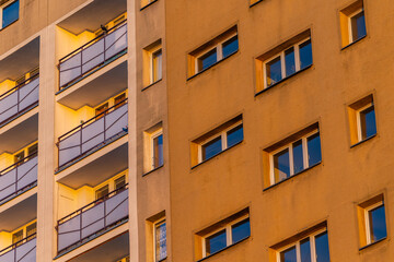 Facade with balconies in an apartment block. Multi-family blocks of flat