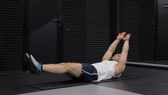 man training abdominal muscles in a fitness club	