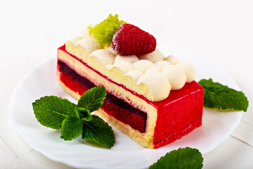 Cake with raspberry berries and mint leaves