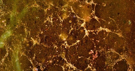 Gold Dust Powder Sparkling Glitter Abstract Background Texture.