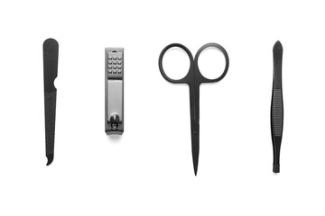 set of steel manicure and pedicure tools isolated on white with copy space. Classic metal kit of nail scissors, tweezer and manicure tools. Domestic nail beauty care objects.