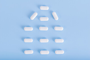 Medicine pills on blue background