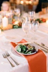 table set for a dinner party with salad