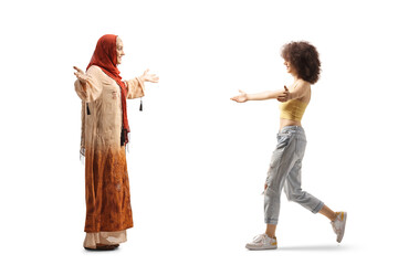 Young muslim woman meeting a caucasian young woman