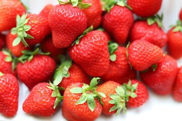 Fresh strawberries on a white background. Close up.