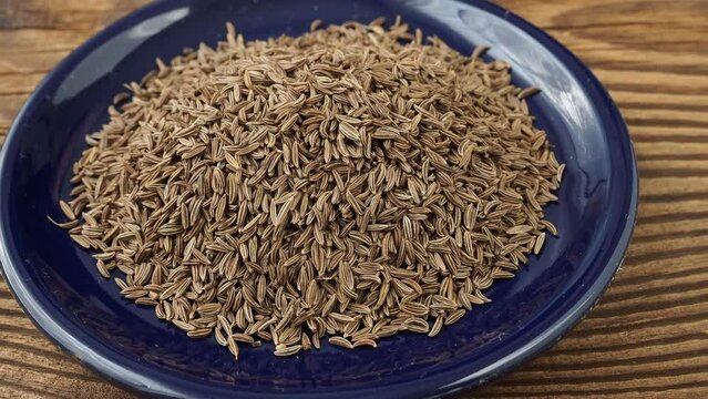 Aromatic roman cumin in a small bowl on the table
