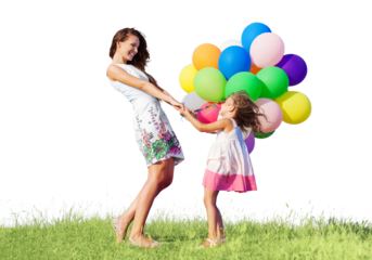 Beautiful happy mother with daughter having fun in green field holding colorful balloons