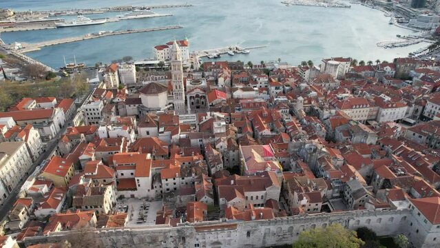 Aerial view of old town Split in Croatia by drone showcasing the fortress, the Diocletian's palace, Saint Domnius cathedral and the bell tower