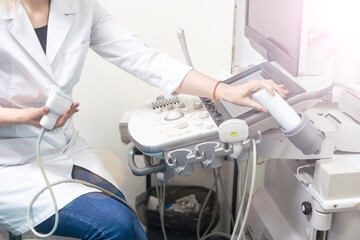 Smiling doctor, ultrasound. The doctor performed an ultrasound