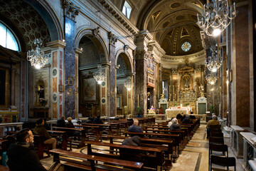 Mass at the baroque church of Santa Maria in Via , Rome, Italy	