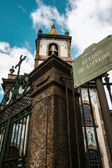 Bottom view of the column of the unknown church wall in the center of Porto, Portugal,