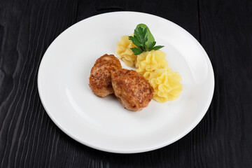 Chicken meat cutlet with mashed potatoes on white plate
