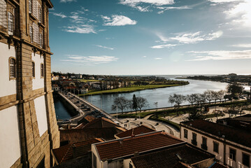 View of the Taipas Bridge in Vila do Conde, the Ave River and blue sky with clouds - Portugal