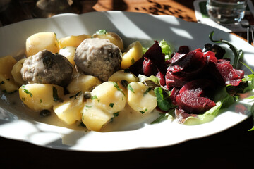 german dish Königsberger Klopse with potatoes and beetroot