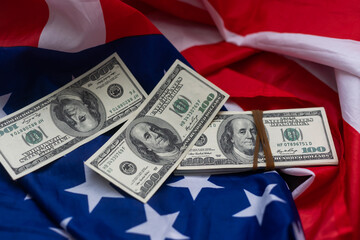 USA national flag and dollar bills. Business and finance concept
