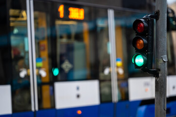 traffic light on the street junction with beautiful bokeh, city with cars in the background