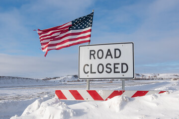 road closed sign with American flag