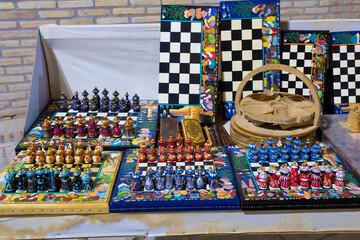 Souvenir chess in national style on the street counter of the souvenir market