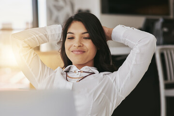 Happy, rest and business woman with laptop in office complete, done and finished with online...