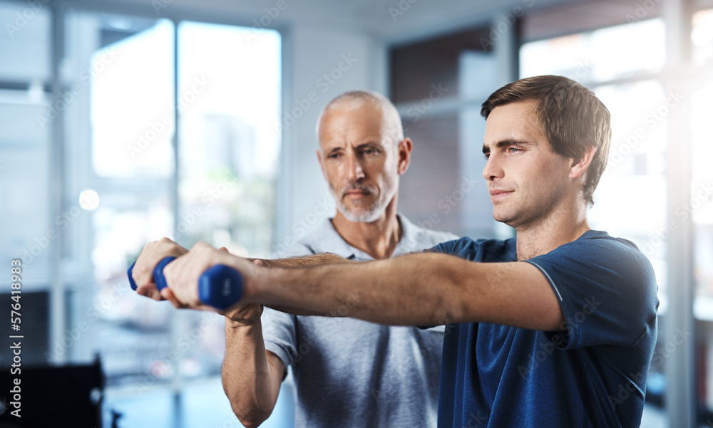 Poster working on joint mobilisation. shot of a physiotherapist helping a patient work through his recovery