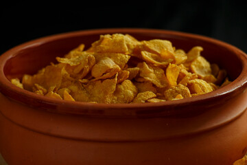 A bowl of cornflakes close up