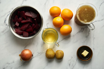 Orange and beetroot soup ingredients onion and potato. Main ingredients is orange and beetroot and stock. Also you need butter and wine