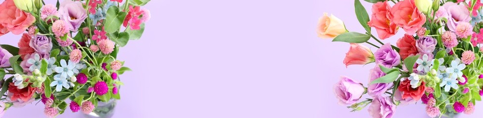 Top view image of pink and purple flowers composition over pastel background