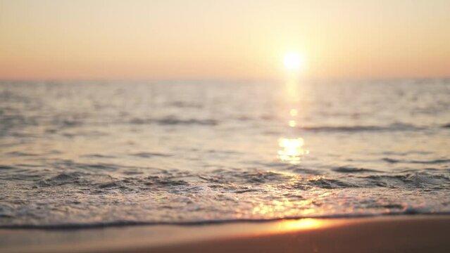 Sunset on a sandy beach on the sea.