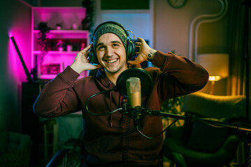 man shooting or streaming video podcast or vlogg blogger at studio