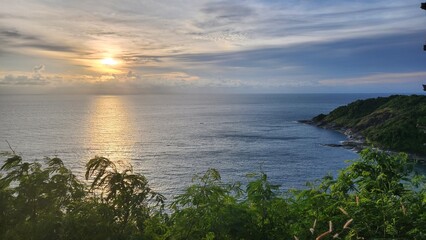 Sunset on the andaman coast, in the background - the sea, the island, plants and sunset.