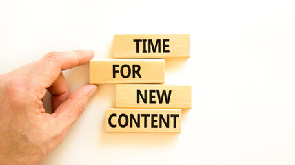 Time for new content symbol. Concept words Time for new content on wooden blocks. Beautiful white table white background. Businessman hand. Business time for new content concept. Copy space.