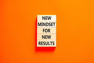 New mindset and results symbol. Concept words New mindset for new results on wooden blocks. Beautiful orange table orange background. Business new mindset for results concept. Copy space