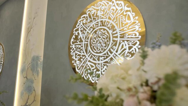 Round shaped window and the calligraphy details in mosque. Scene. Concept of architecture and religion.