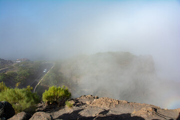Fog in the mountains with road on Tenerife in Spain