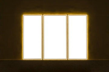 three-leaf window glowing in the dark against a dark wall with space for text