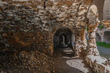 Obraz premium Brick ruins and ruined rooms of old fortification fort outpost. Popular monument of military history and travel destination, Tarakaniv, Ukraine