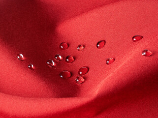 Red technological waterproof and breathable fabric with drops