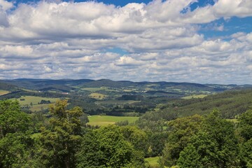 Fototapeta na wymiar A view to the landscape with fields, meadows and forests near castle Kasperk, Czech republic