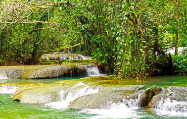 Tropical natural cascade jungle waterfall, green turquoise pools - YS falls, Jamaica
