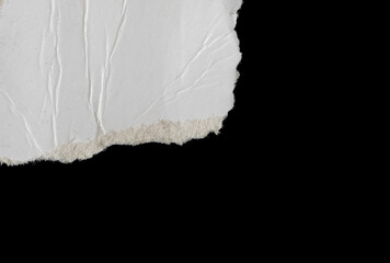 a white piece of paper on a black isolated background